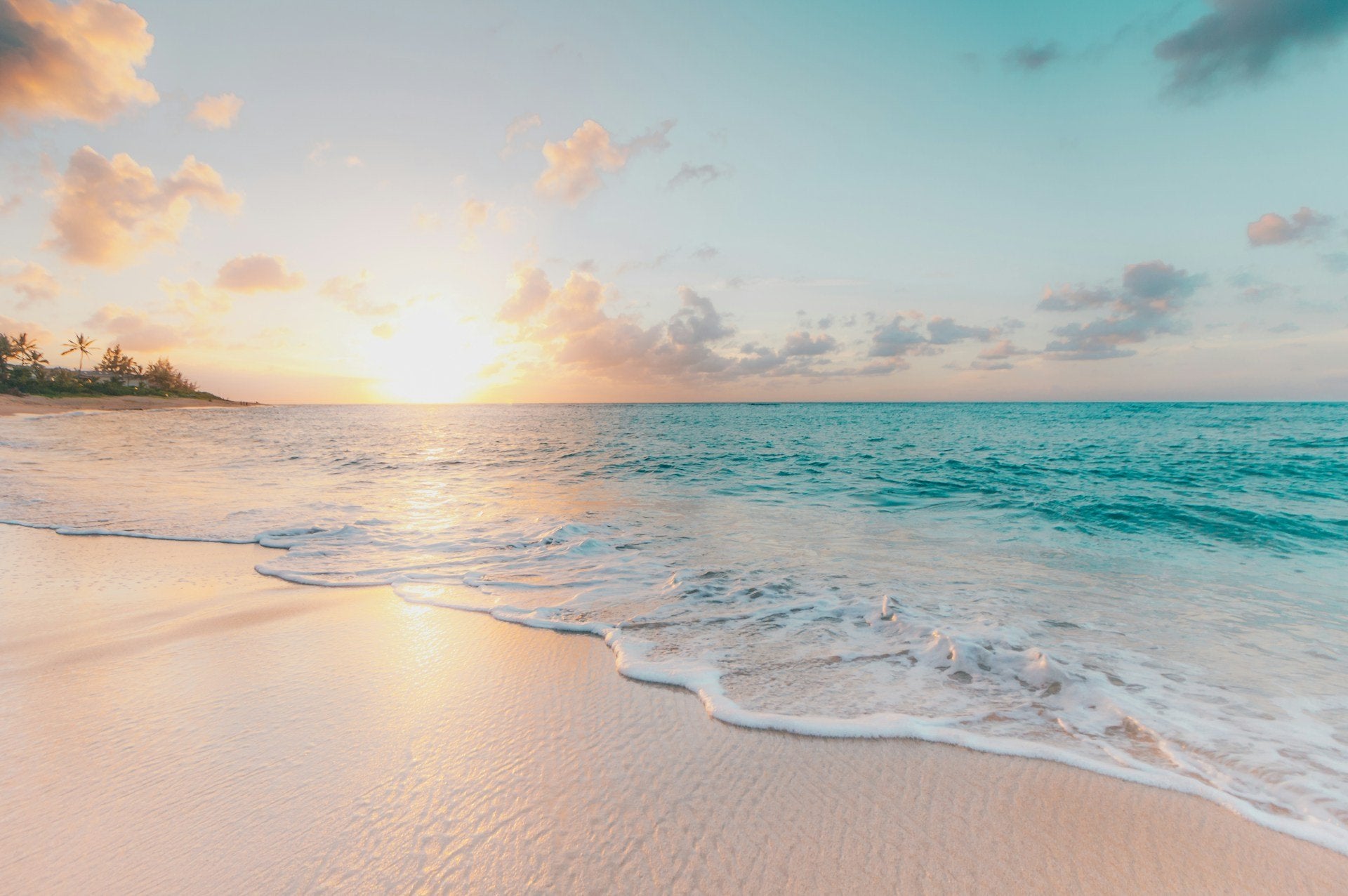 Water and sand at beach sunset
